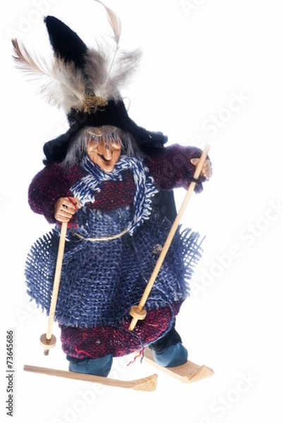 Fototapeta epiphany witch with skis on a white background