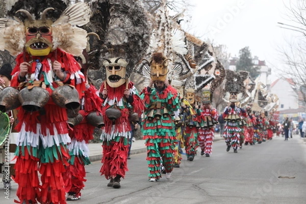 Obraz First masquerade festival "Djamala" in Kyustendil, Bulgaria. People with mask called Kukeri dance and perform to scare the evil spirits.