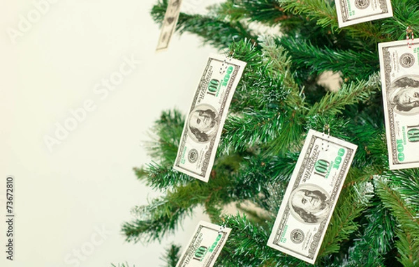 Fototapeta Christmas tree decorated with dollars notes