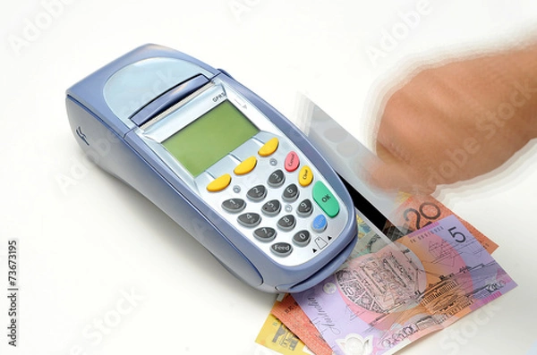 Obraz EFTPOS machine with credit cards and Australian money.