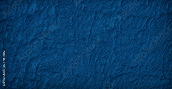 Obraz A blue wall with a rough texture is shown in this image