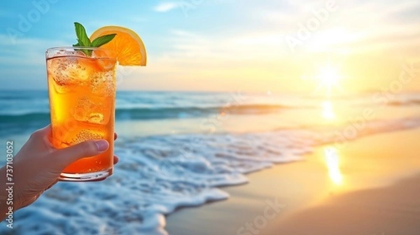 Obraz Man enjoying long island iced tea cocktail on tropical beach on hot summer day with copy space