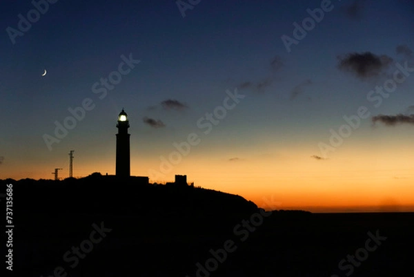 Fototapeta lighthouse at sunset
