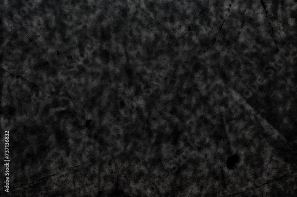 Fototapeta A black background with scratches and stains