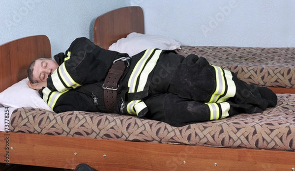 Obraz Dressed sleeping fireman