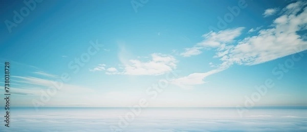 Fototapeta Serene Blue Sky and Fluffy Clouds Panorama