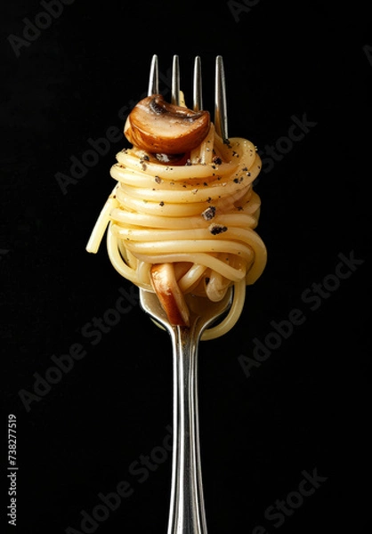 Obraz Minimal food concept, pasta, long spaghetti rolled on a fork on a black background, pasta fine dining.