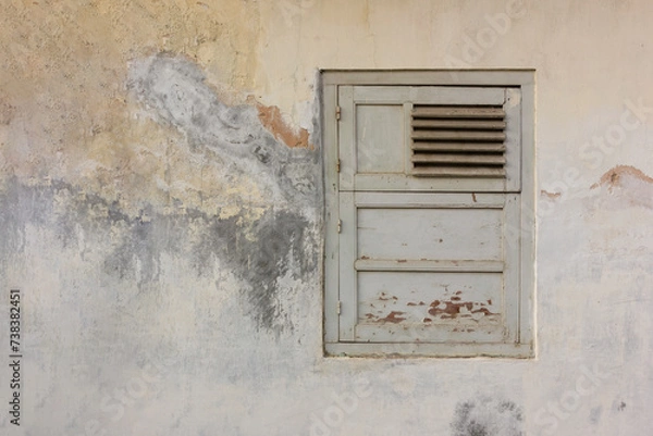 Fototapeta Old wooden window in gray color with old broken wall