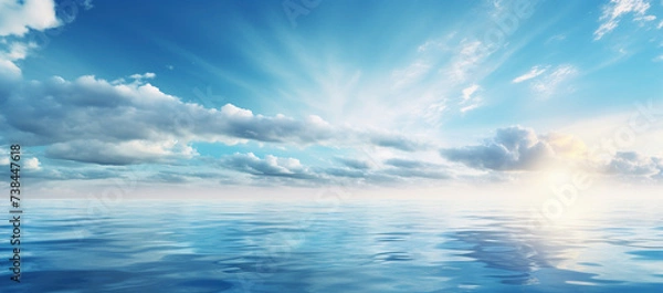 Fototapeta Sky and clouds over water on a blue horizont
