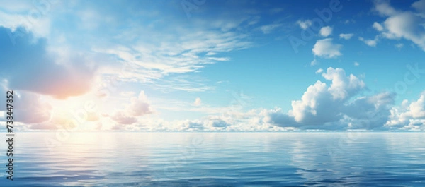 Fototapeta Sky and clouds over water on a blue horizont