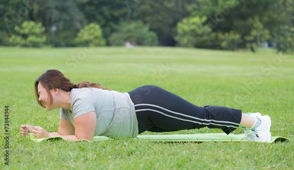 Obraz obese women planking on grass
