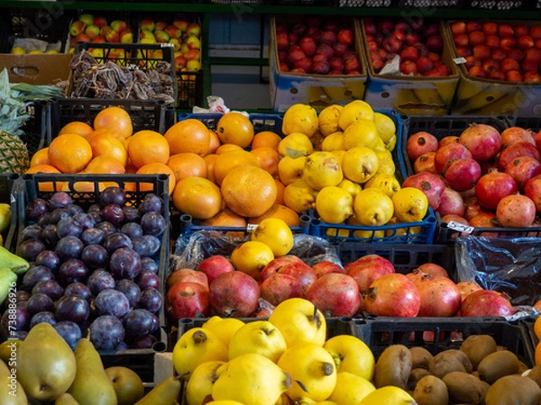 Fototapeta Fruits at the eastern market. Fruits in boxes for sale. The atmosphere of an oriental bazaar