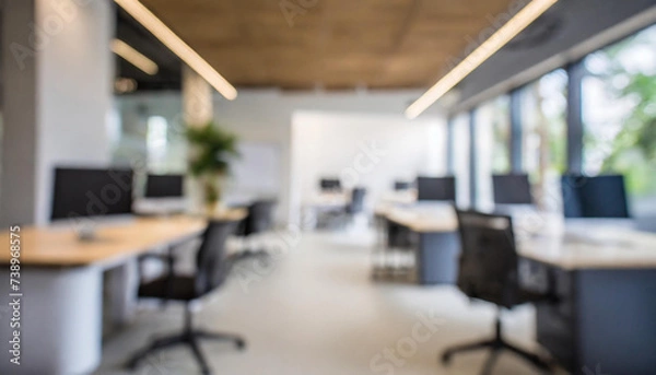 Fototapeta Blurred office interior space background. Blurred interior of modern office workplace a workspace design without partition decorate with black, white and wooden furniture