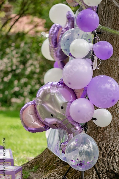 Fototapeta Background with elephant and purple, white, lavander balloons for birthday party. Baby shower. Celebration baptism concept. Photo wall, arch with decor.