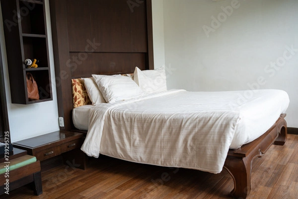 Fototapeta Cozy clean bedroom in tropical resort villa luxury hotel