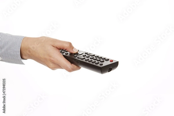 Obraz Hand hält schwarze Fernbedienung, perspektivisch