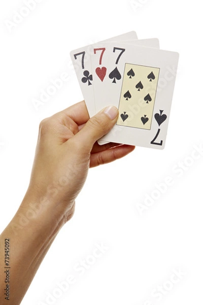 Fototapeta Hand hält drei Sieben