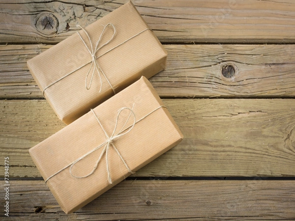 Fototapeta parcels  wrapped in brown paper and string