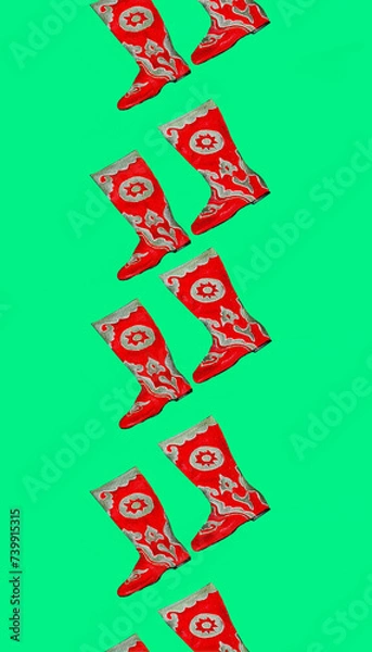 Fototapeta national Tatar red boots with a green folk pattern,an ornament without seams with the inscription of a national song with field fragrant spring flowers of purple and lilac color