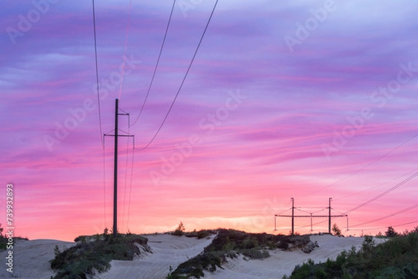 Obraz Silhouette of large overhead power lines during sunrise in Estonia, Northern Europe	