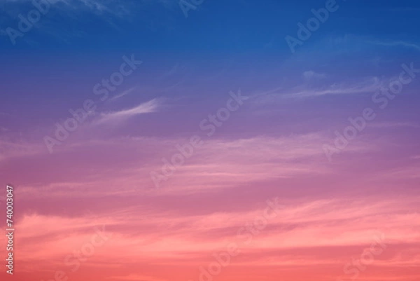 Fototapeta Early morning light sky before sunrise. Soft purple, pink and orange light on the horizon. Empty natural sky with colorful pastel tone colors for background. Vivid colors in modern mood.
