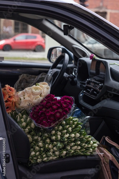 Fototapeta The car full of bright, colourful, beautiful flowers. The car full of different, colourful tulips.