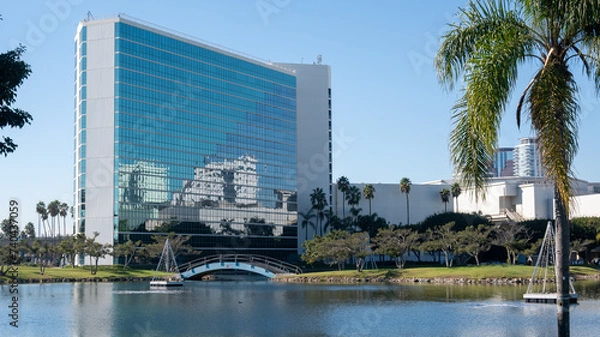 Fototapeta city building with reflection of another city building in long beach california. 
