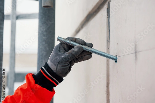 Obraz Man hand with big screw preparing wall for core drilling