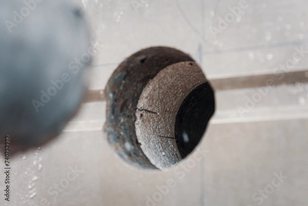 Obraz Drilled hole into a concrete wall with core driller