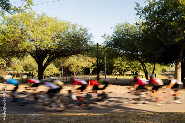 Fototapeta group of cyclists competing in speed race