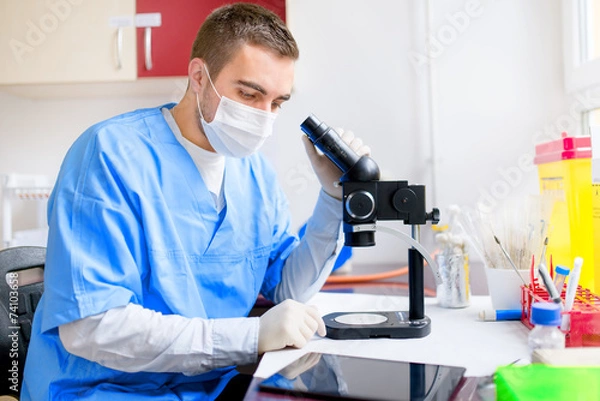 Fototapeta male researcher carrying out scientific research in a laboratory