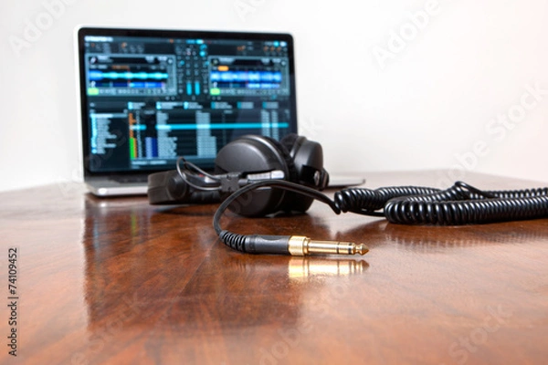 Fototapeta Headphones on a laptop computer