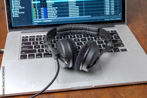 Fototapeta Headphones on a laptop computer