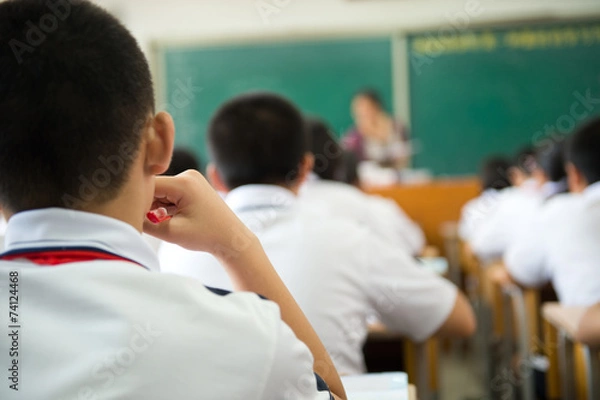 Fototapeta studying in classroom