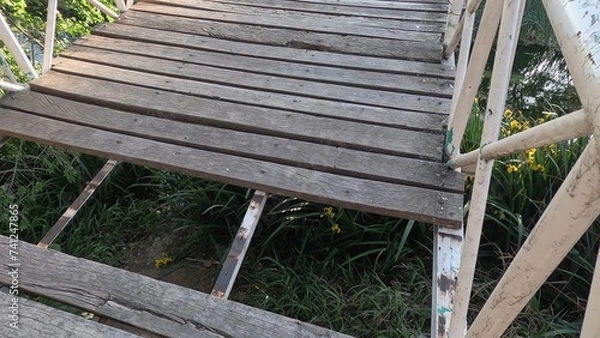 Obraz The destroyed wooden bridge over the river