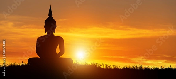 Fototapeta Silhouette of Buddha mediating in the twilight with sunrise background. Magha Puja, Asanha Puja, and Visakha Puja Day. Buddhist holiday Concept.