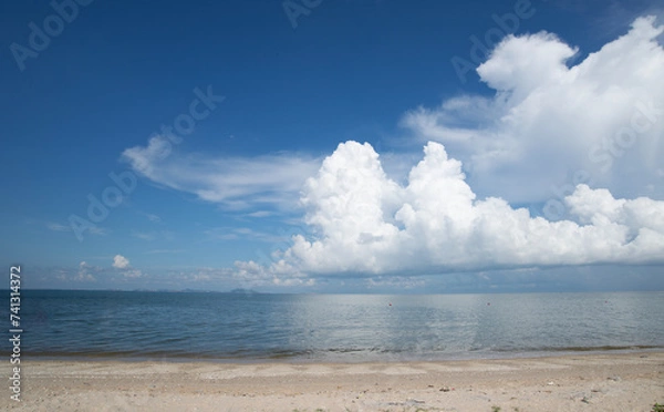 Obraz Beautiful tropical beach with blue sky and white clouds abstract texture background. Copy space of summer vacation and holiday business travel concept.
