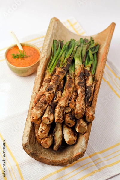 Obraz Calçots and its sauce. Typical meal from Catalonia, Spain. They are a type of green scallions.