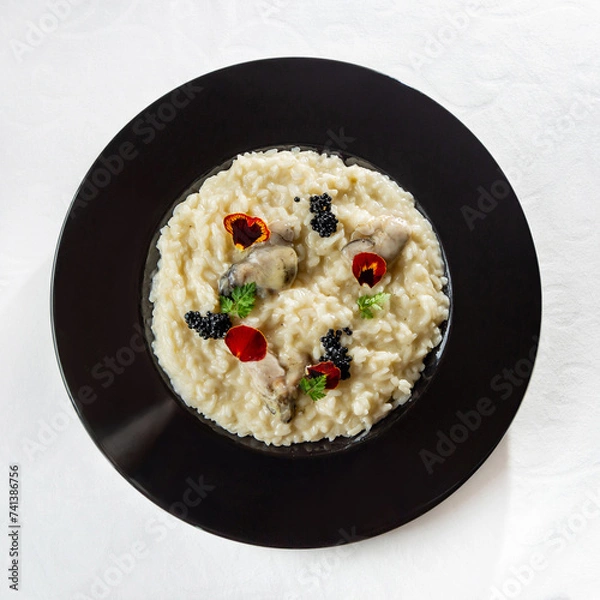 Obraz risotto on black plate