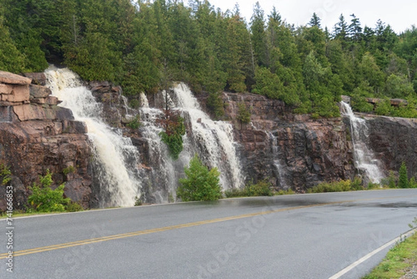 Fototapeta Cadillac Mountain Summit Road in Acadia National Park, Maine. Temporary waterfalls after heavy rain.  Heavy rains created rare waterfalls.