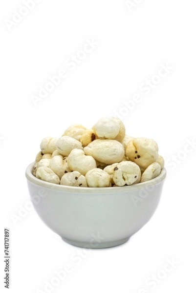 Obraz Makhana or Fox Nut in a White Bowl Isolated on White Background with Copy Space, Also Known as Lotus Seed Pop, Euryale Ferox or Gorgon Nut