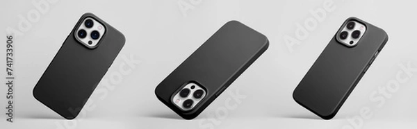 Obraz set of three iPhone 15 and 14 Pro max in black silicone case falling down in different angles, back view isolated on grey background, smartphone mockup