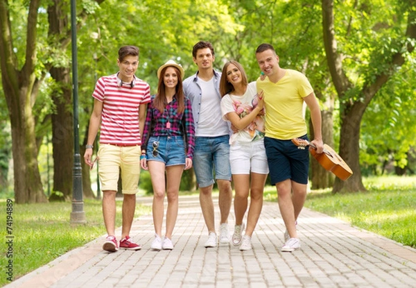 Fototapeta Young friends having fun outdoor