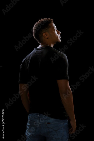 Fototapeta Portrait young African man from behind