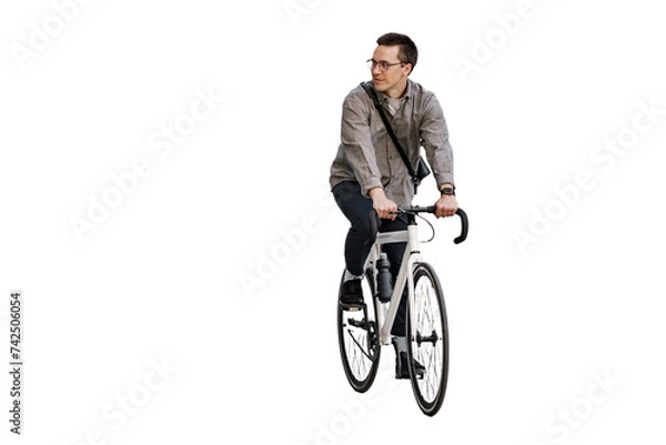 Obraz A man riding his bicycle as a means of eco-friendly transportation in the city.

