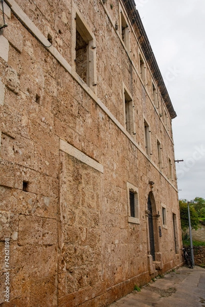 Fototapeta 'House Within a House', or Kuca U Kuci, in Bol on Brac Island, Croatia. This shows the outer house. In the 19th century, a newer house was built around an existing house which was never demolished