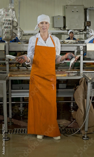 Fototapeta Processing of fish at the fish factory
