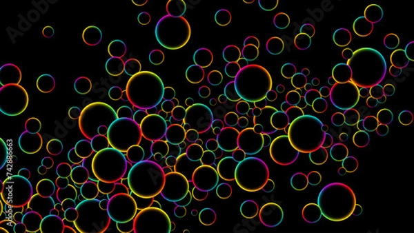 Fototapeta Colorful rainbow random flying glowing circles, spheres or bubbles. Luminous floating balls shine with rainbow colors on black background. Fluorescent circle particles dynamic flow. Vector background
