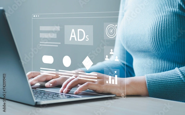 Fototapeta Digital online sales concept, businessman using laptop with website advertisement digital marketing Digital marketing and online advertising to target customers