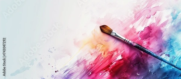 Fototapeta Artist draws colorful gradients in watercolor paint on a white canvas with an art brush View from behind the shoulder Drawing with watercolors in a home art studio. with copy space image